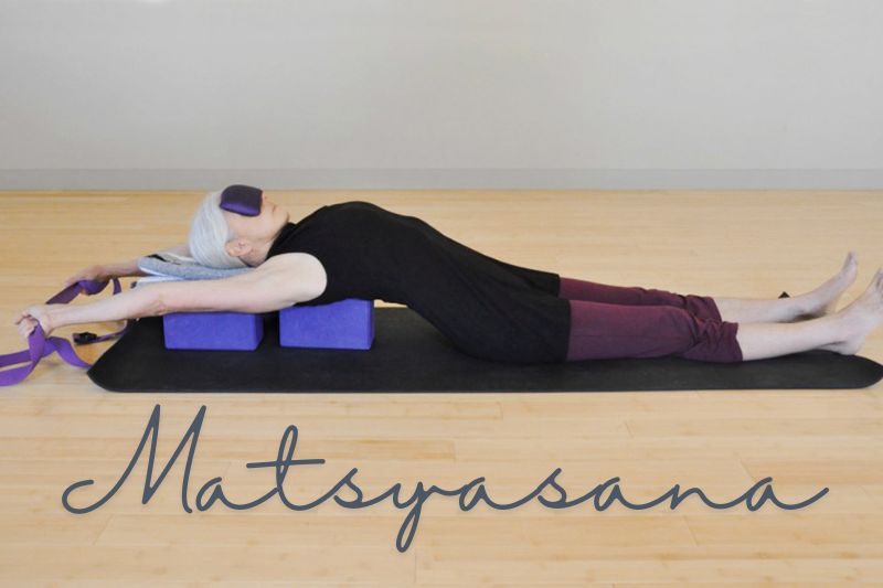 Supported Fish Pose (Matsyasana) with Bolster Yoga Pose